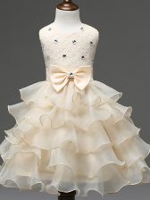  Knee Length Zipper Little Girls Pageant Dress Champagne for Wedding Party with Lace and Ruffled Layers and Bowknot