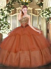  Sleeveless Tulle Floor Length Lace Up Quinceanera Gown in Rust Red with Beading and Ruffled Layers